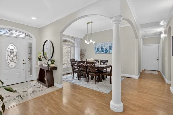a view of a dining room with furniture and wooden floor