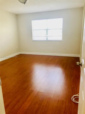 a view of small space with wooden floor