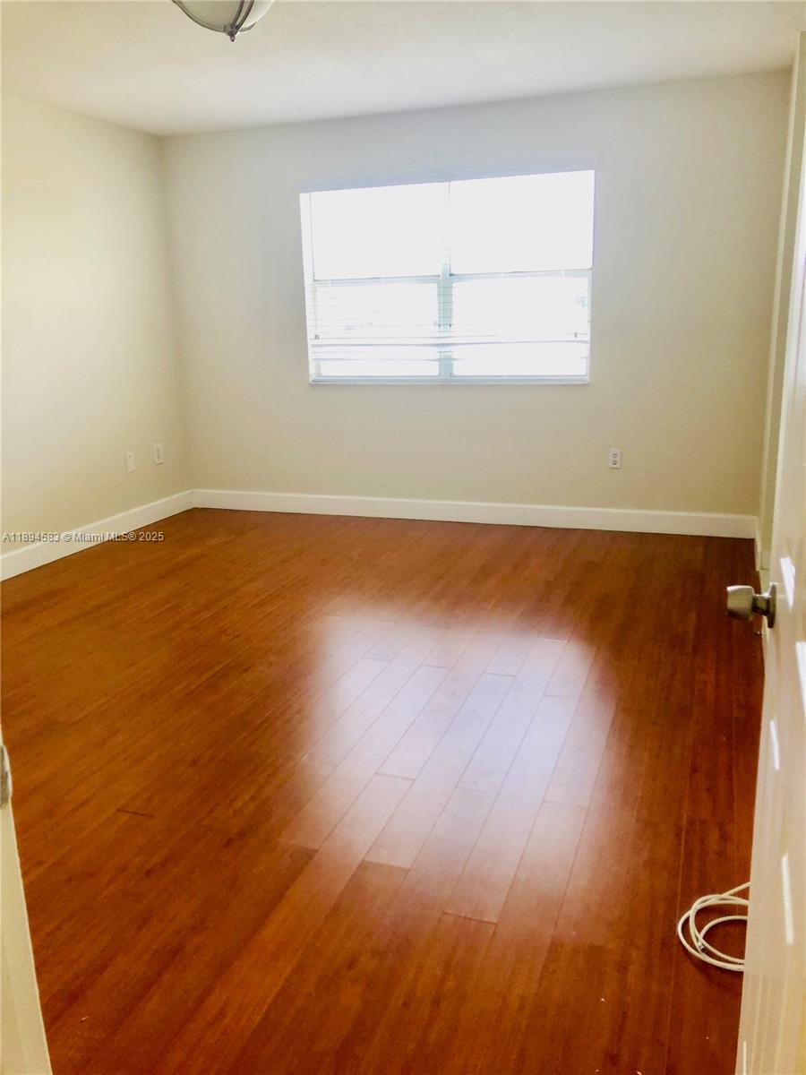 1010 Southwest 99th Avenue Pembroke Pines, FL 33025 - Photo 11 of 22 wooden floor in a bathroom