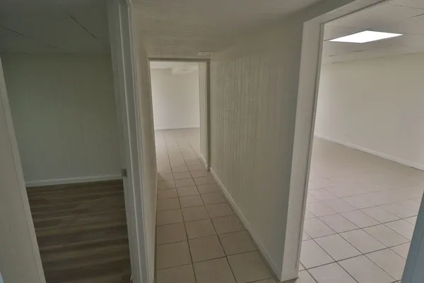 a view of a wooden deck and a backyard