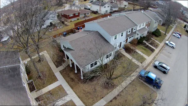 an aerial view of a house with a lot of buildings