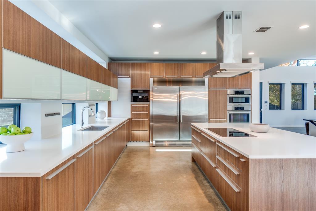 9317 Midway Road Dallas, TX 75220 - Photo 11 of 30 a kitchen with stainless steel appliances kitchen island granite countertop a sink and cabinets