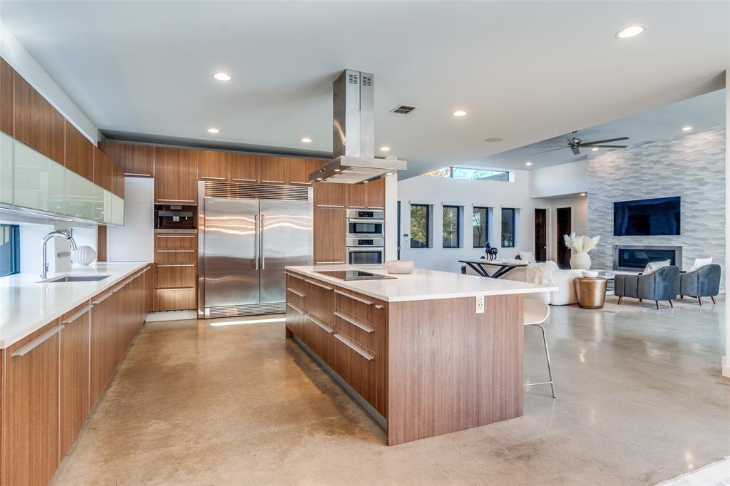 9317 Midway Road Dallas, TX 75220 - Photo 12 of 30 a large kitchen with stainless steel appliances granite countertop a large counter top and a stove