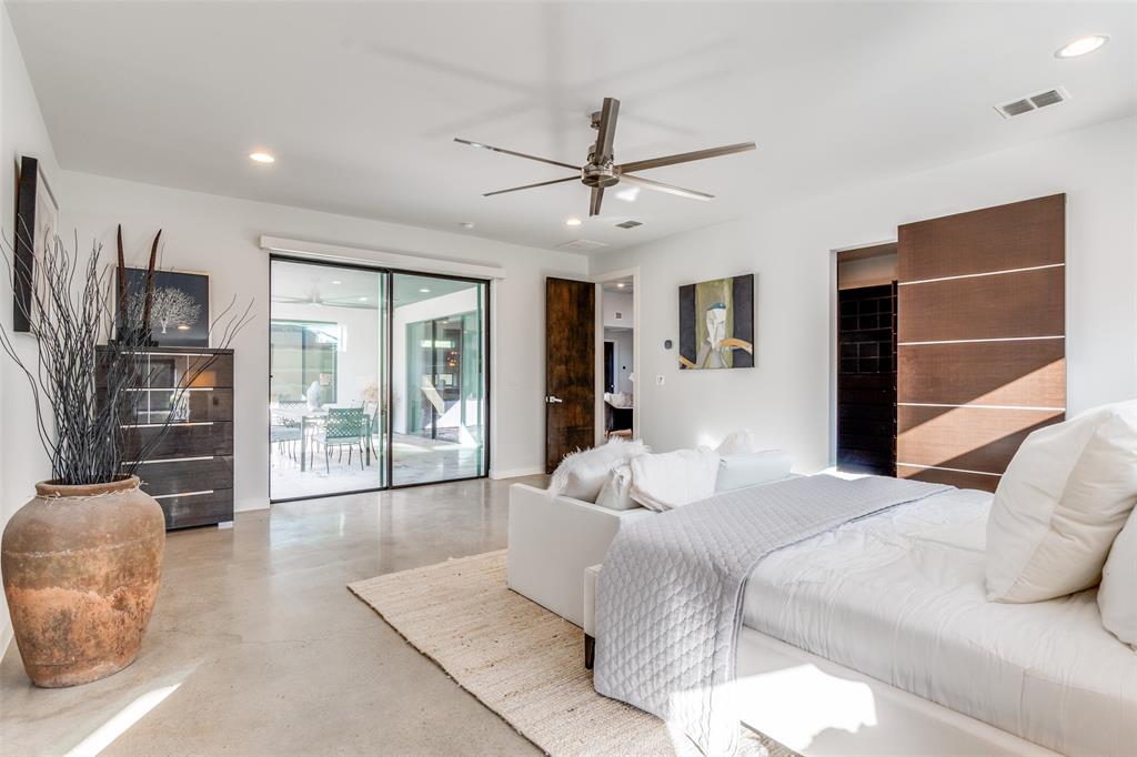 9317 Midway Road Dallas, TX 75220 - Photo 18 of 30 a bedroom with a large bed and a large window