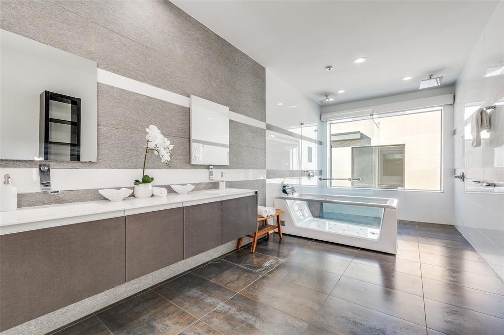 9317 Midway Road Dallas, TX 75220 - Photo 19 of 30 a bathroom with a tub sink and mirror