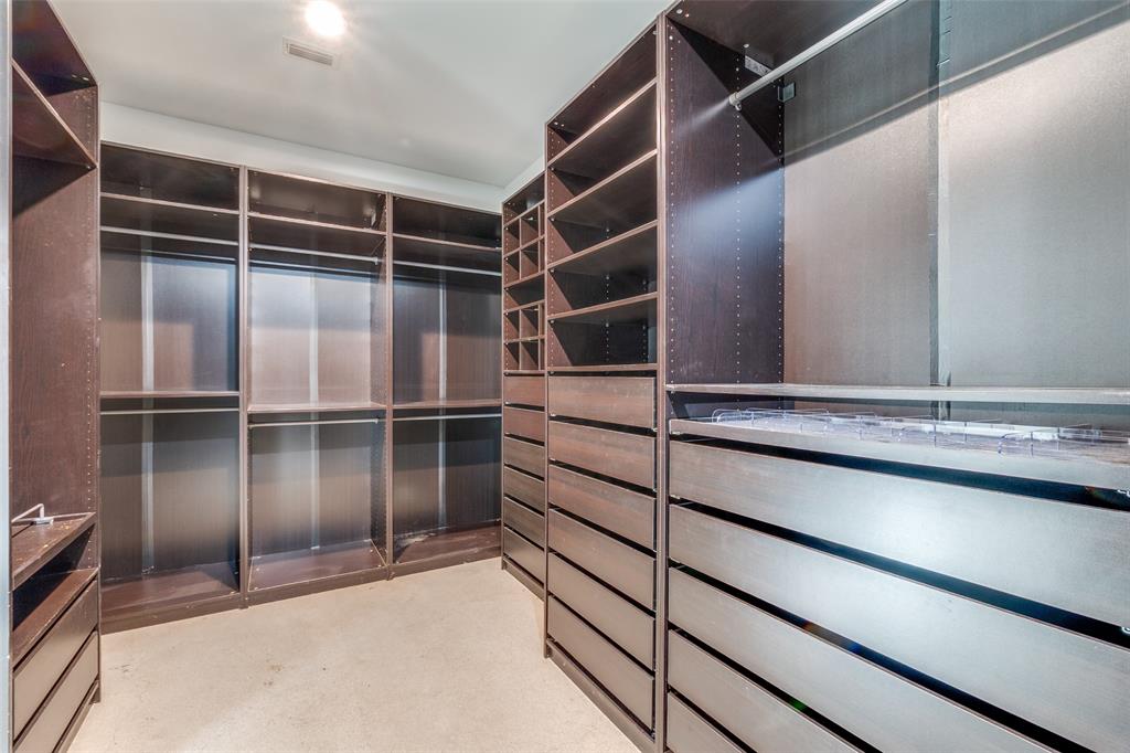 9317 Midway Road Dallas, TX 75220 - Photo 21 of 30 a view of walk in closet with empty racks