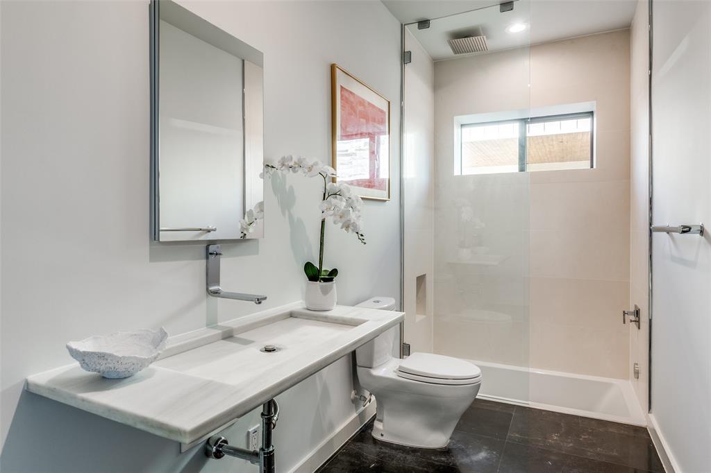9317 Midway Road Dallas, TX 75220 - Photo 24 of 30 a bathroom with a sink toilet and shower
