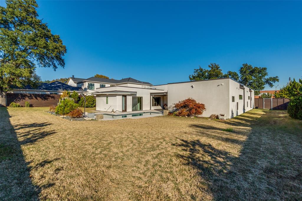 9317 Midway Road Dallas, TX 75220 - Photo 28 of 30 a view of a house with a yard