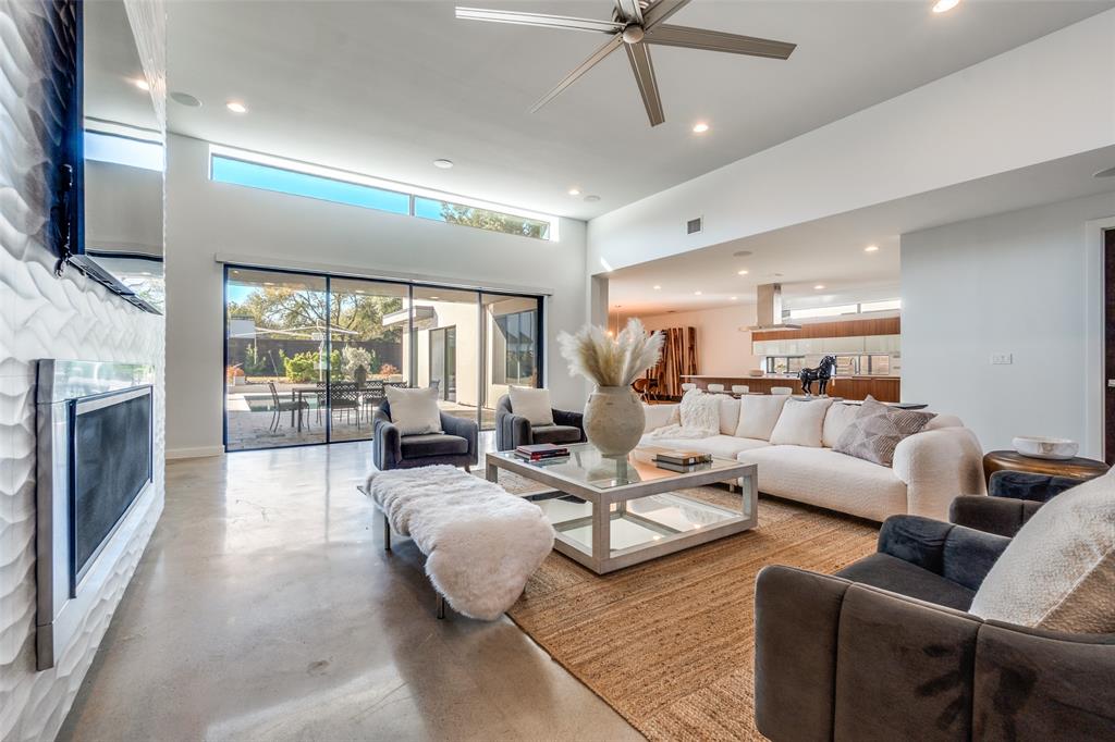 9317 Midway Road Dallas, TX 75220 - Photo 6 of 30 a living room with furniture fireplace and flat screen tv