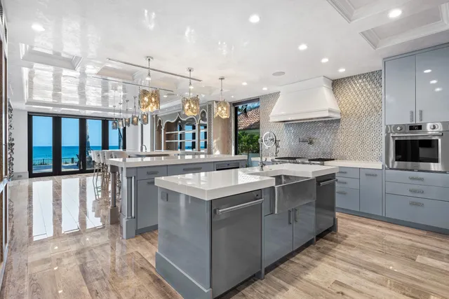 a kitchen with stainless steel appliances granite countertop a stove and cabinets