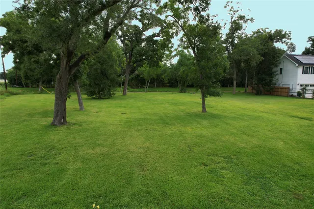 a view of outdoor space with deck and yard