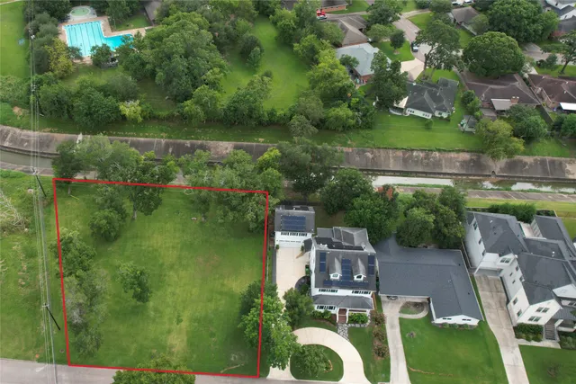 a aerial view of a house with pool outdoor seating and yard