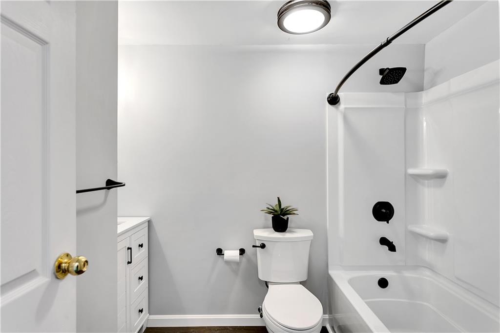 237 Acre Avenue Butler, PA 16001 - Photo 20 of 34 a white toilet sitting next to a bathroom sink and tub