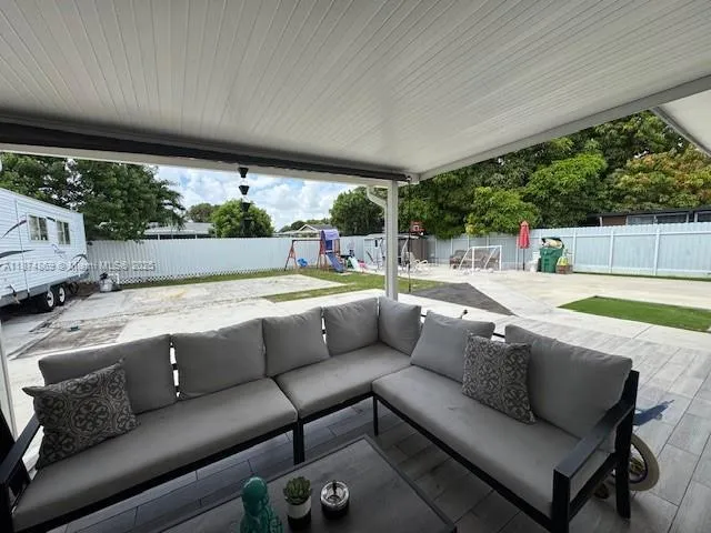 a view of a patio with couches chairs and a table