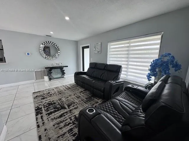 a living room with furniture and a window
