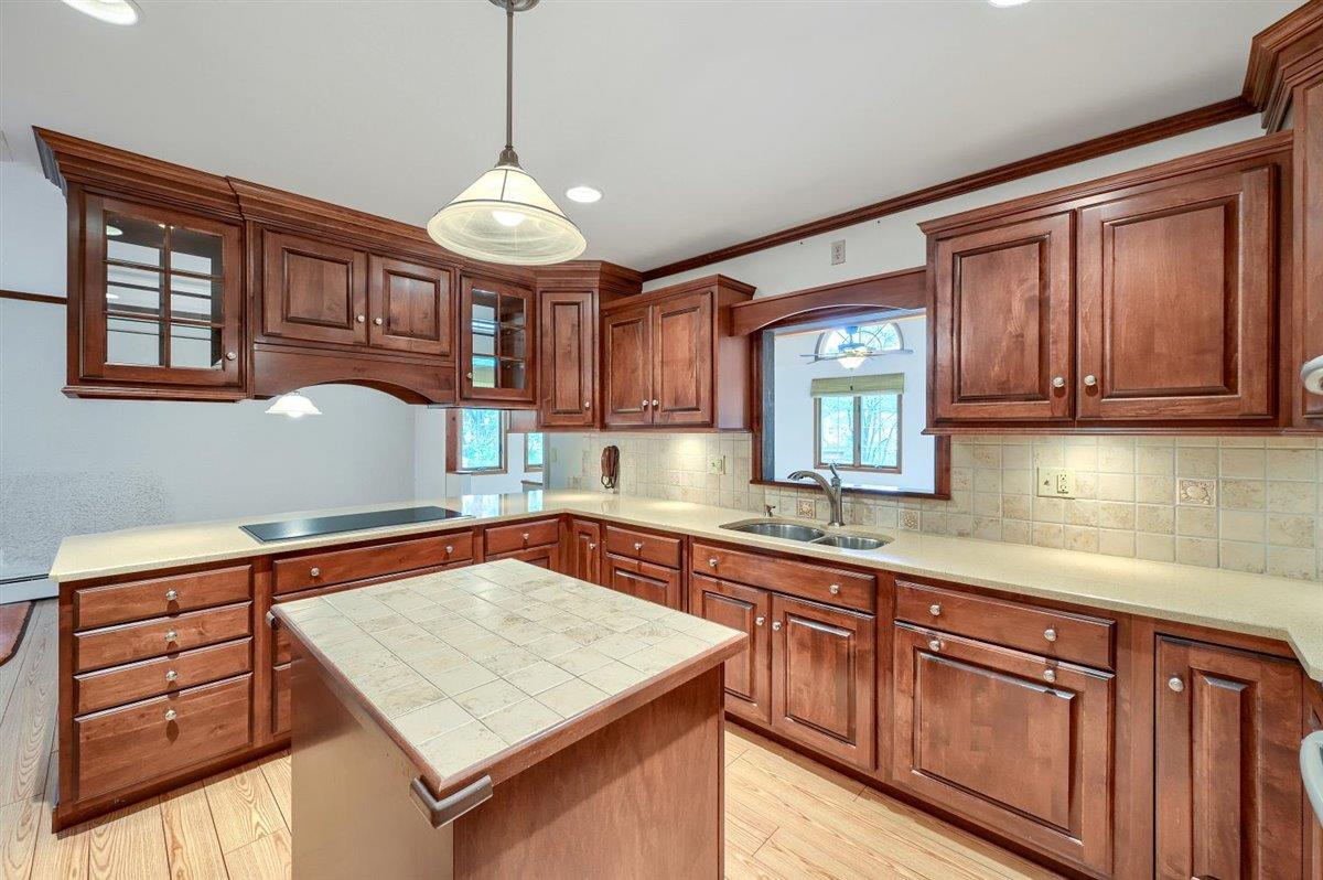 129 Barnes Road Washingtonville, NY 10992 - Photo 12 of 48 a kitchen with stainless steel appliances granite countertop wooden cabinets a stove a sink and dishwasher