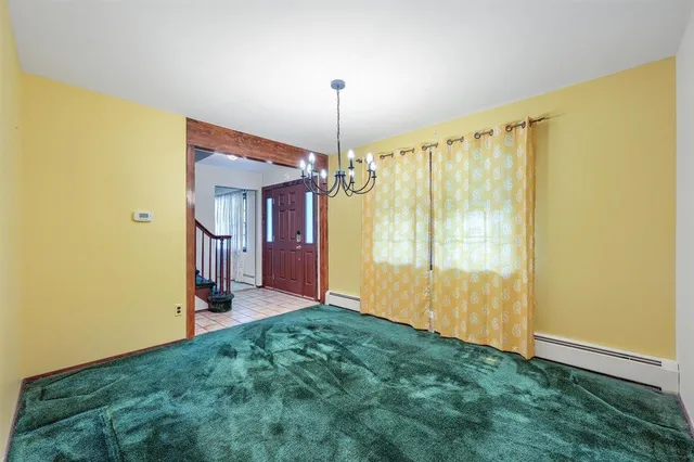 a view of a kitchen with a sink and a refrigerator