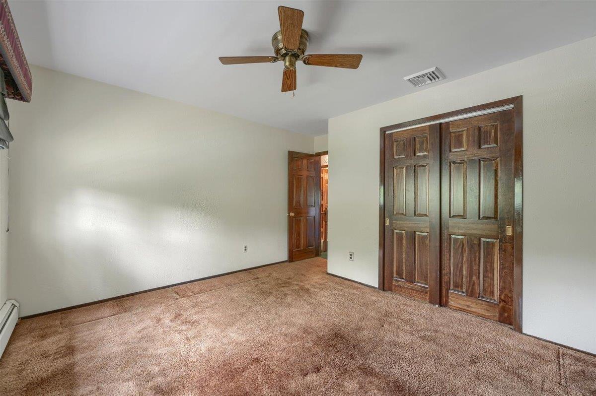 129 Barnes Road Washingtonville, NY 10992 - Photo 26 of 48 an empty room with a ceiling fan and a window