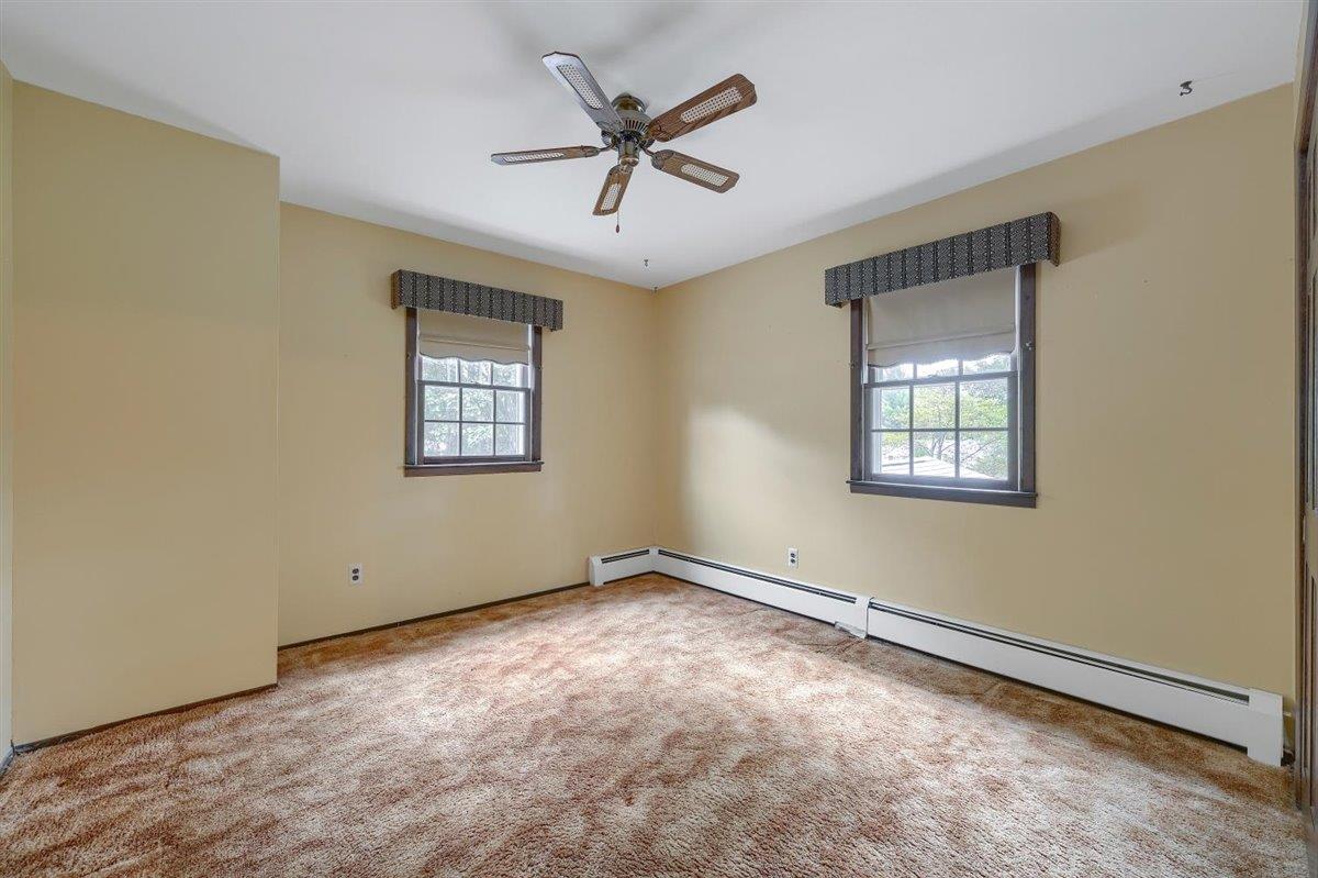 129 Barnes Road Washingtonville, NY 10992 - Photo 29 of 48 an empty room with windows and fan
