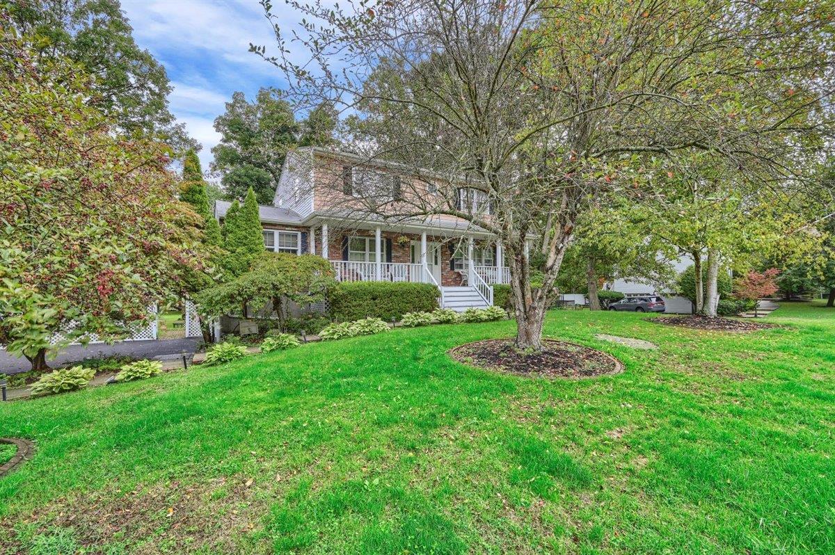 129 Barnes Road Washingtonville, NY 10992 - Photo 3 of 48 a front view of a house with a garden