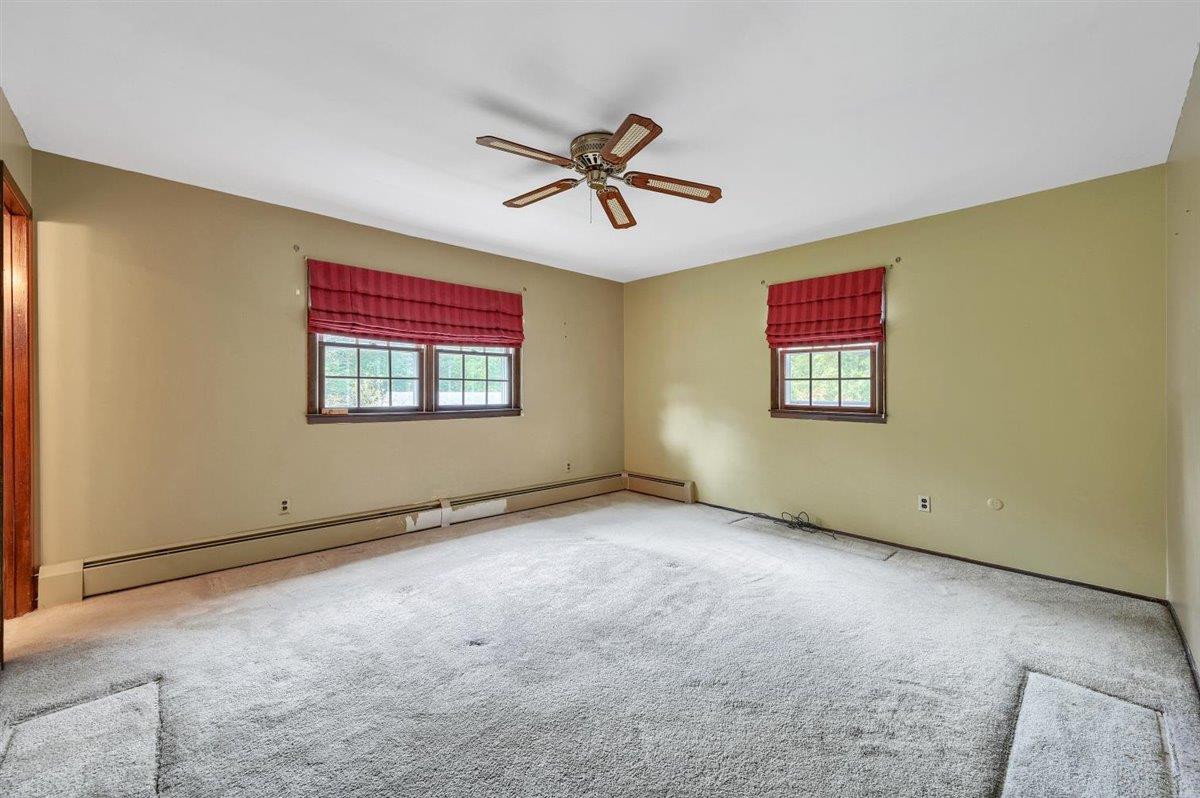 129 Barnes Road Washingtonville, NY 10992 - Photo 30 of 48 an empty room with windows and fan