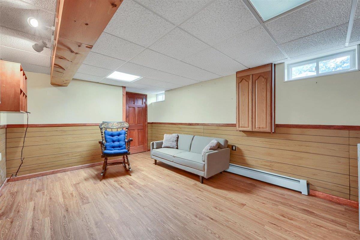 129 Barnes Road Washingtonville, NY 10992 - Photo 34 of 48 a living room with furniture and a wooden floor