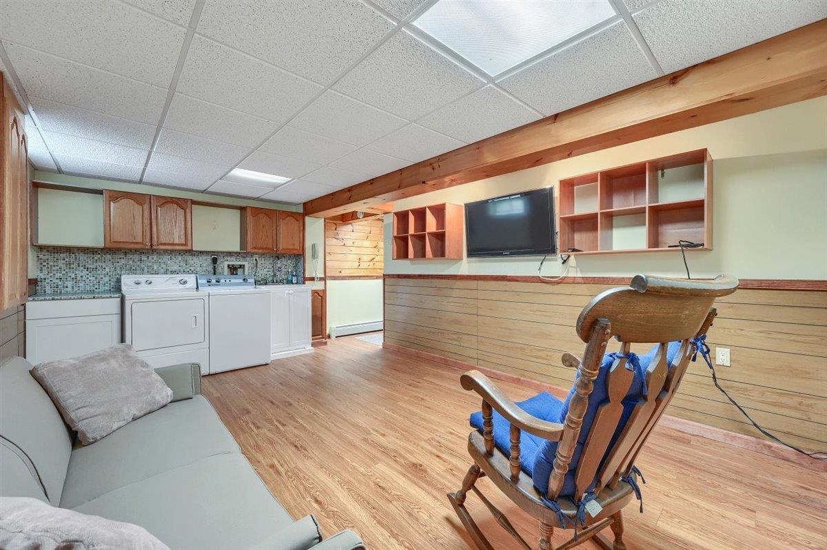 129 Barnes Road Washingtonville, NY 10992 - Photo 35 of 48 a living room with stainless steel appliances kitchen island granite countertop furniture and a kitchen view