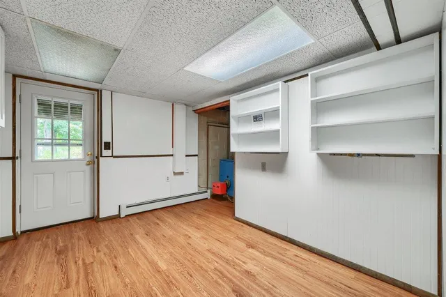 a living room with stainless steel appliances kitchen island granite countertop furniture and a kitchen view