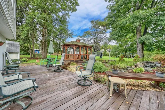 a view of a house with wooden deck