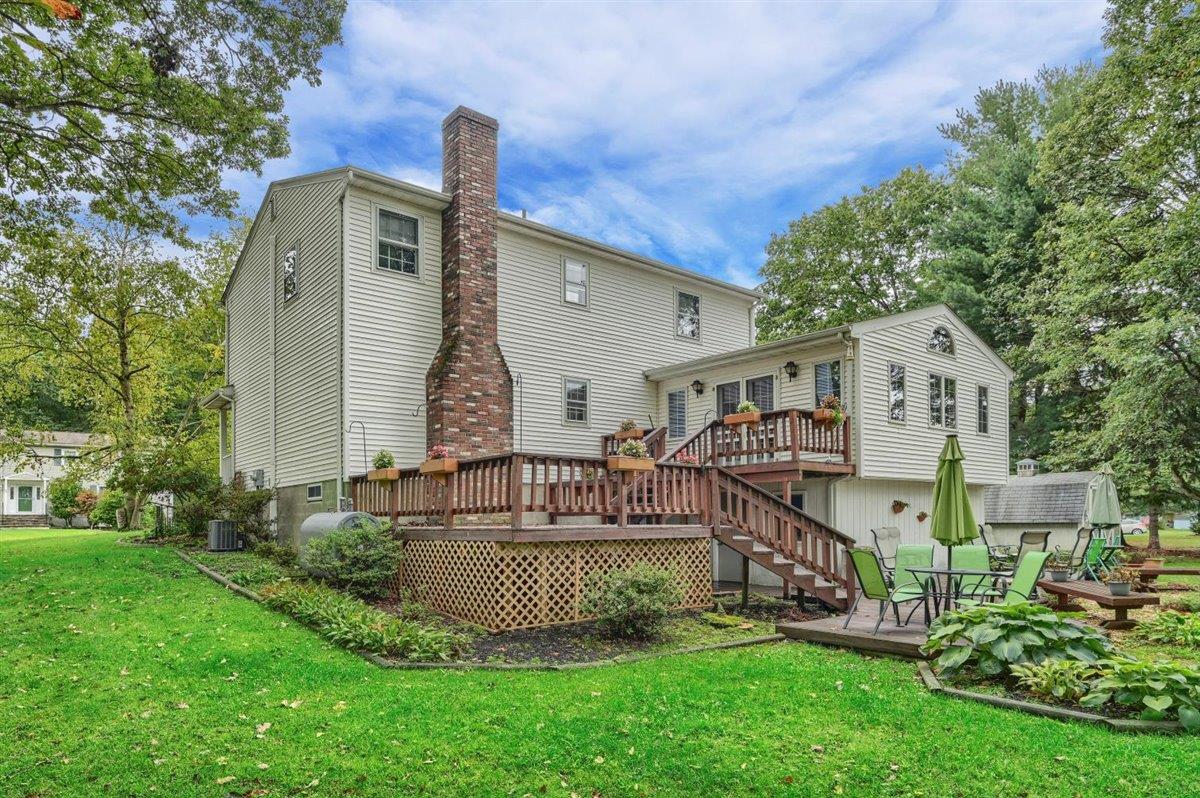 129 Barnes Road Washingtonville, NY 10992 - Photo 42 of 48 a front view of house with a garden and deck