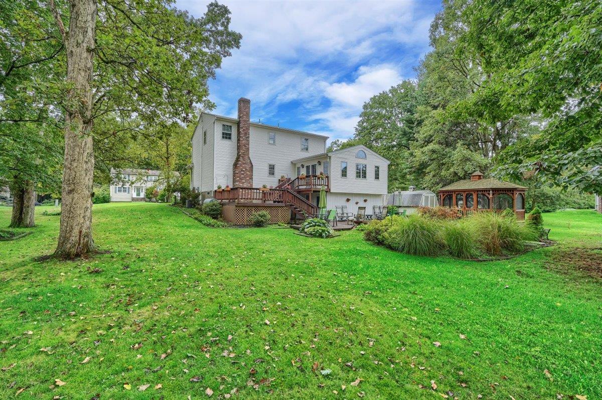 129 Barnes Road Washingtonville, NY 10992 - Photo 43 of 48 a front view of a house with garden