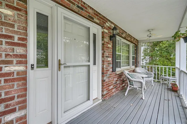 a view of a balcony with table and chairs