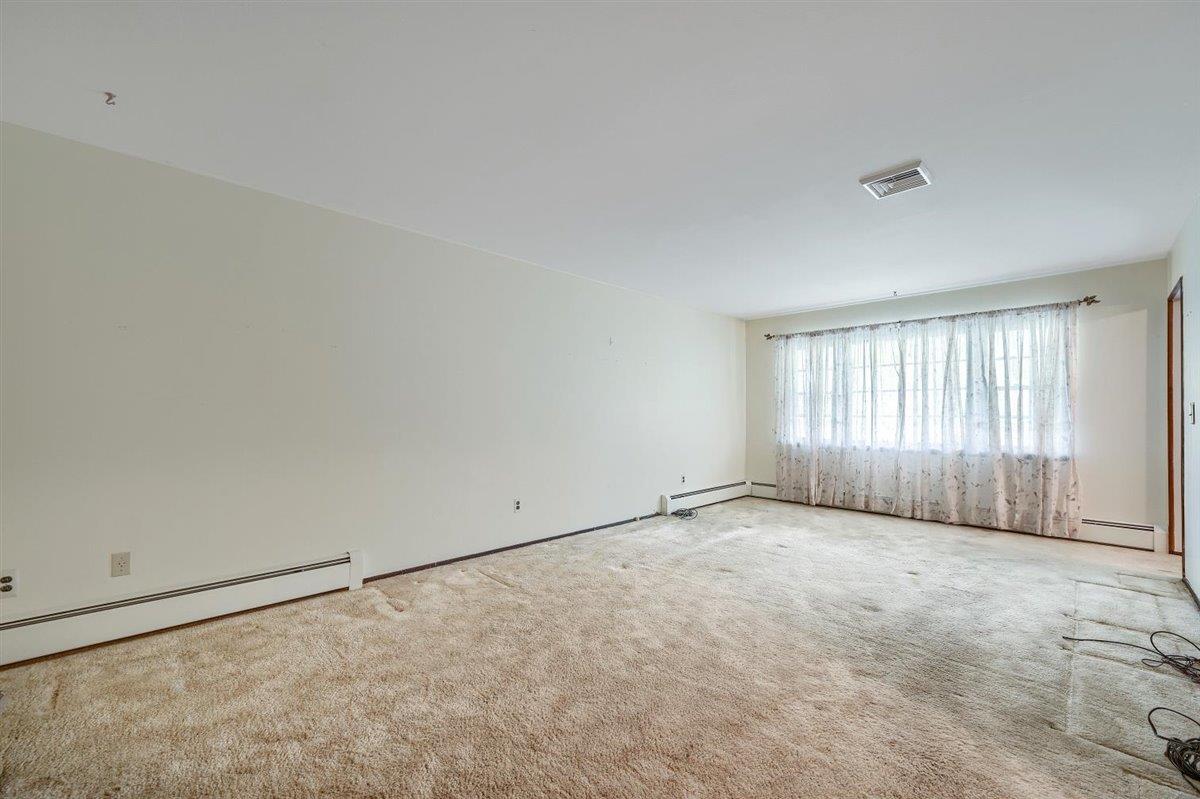 129 Barnes Road Washingtonville, NY 10992 - Photo 10 of 48 a view of an empty room with a window