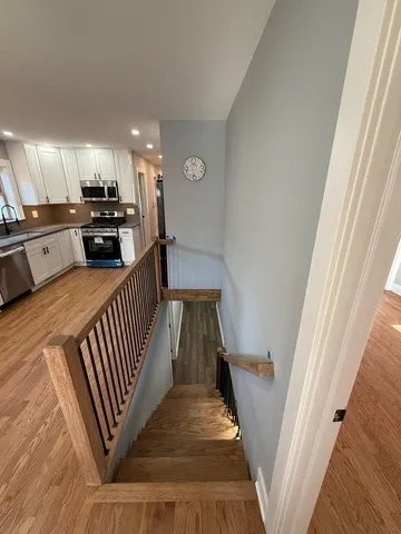 a view of a hallway view with staircase