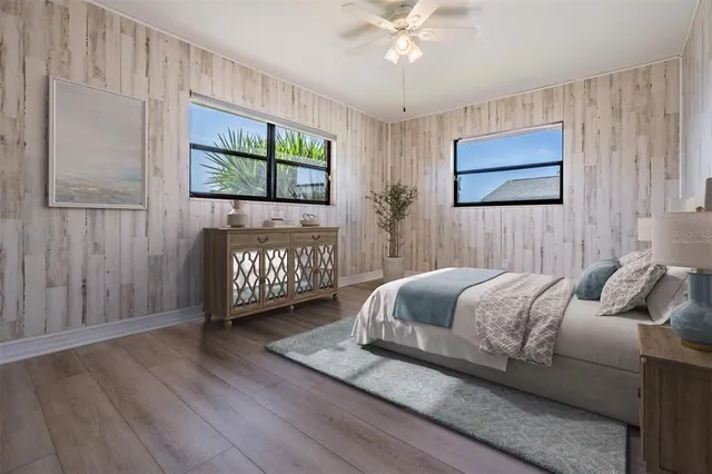 a bedroom with a large bed and a window