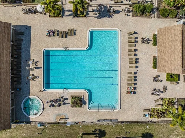 a view of a swimming pool with a patio