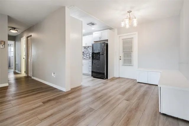 a view of a livingroom with wooden floor