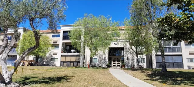 a front view of a building with garden