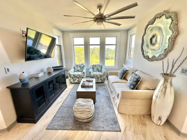 a living room with furniture and a flat screen tv