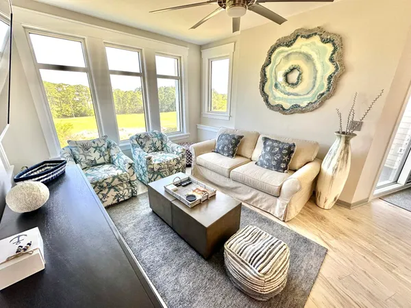 a living room with furniture and a window