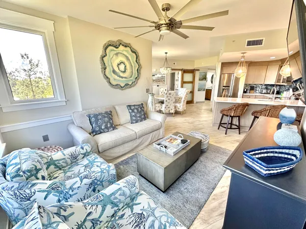 a living room with furniture and a large window