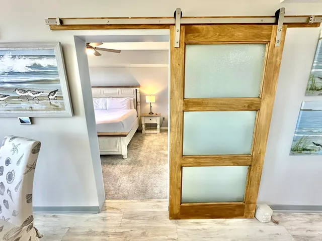 a bedroom with a bed and a table