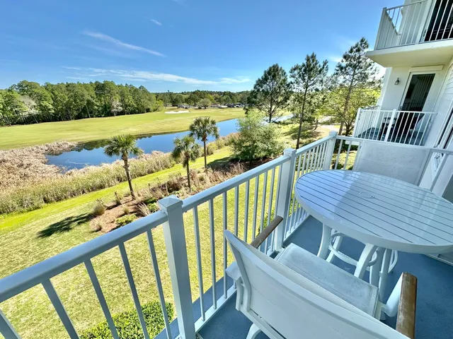 a living room with furniture window and wooden floor