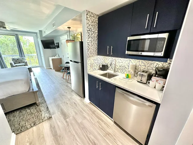 a bedroom with a bed window and a couch