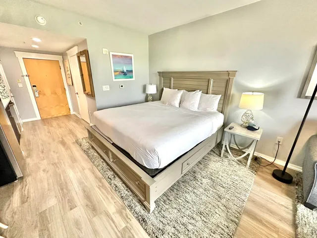 a view of balcony with wooden floor and fence