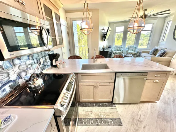 a kitchen with a stove and a sink