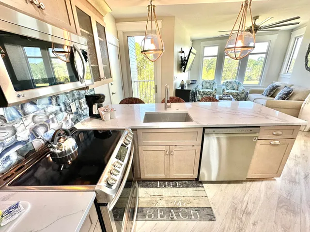 a kitchen with a stove and a sink