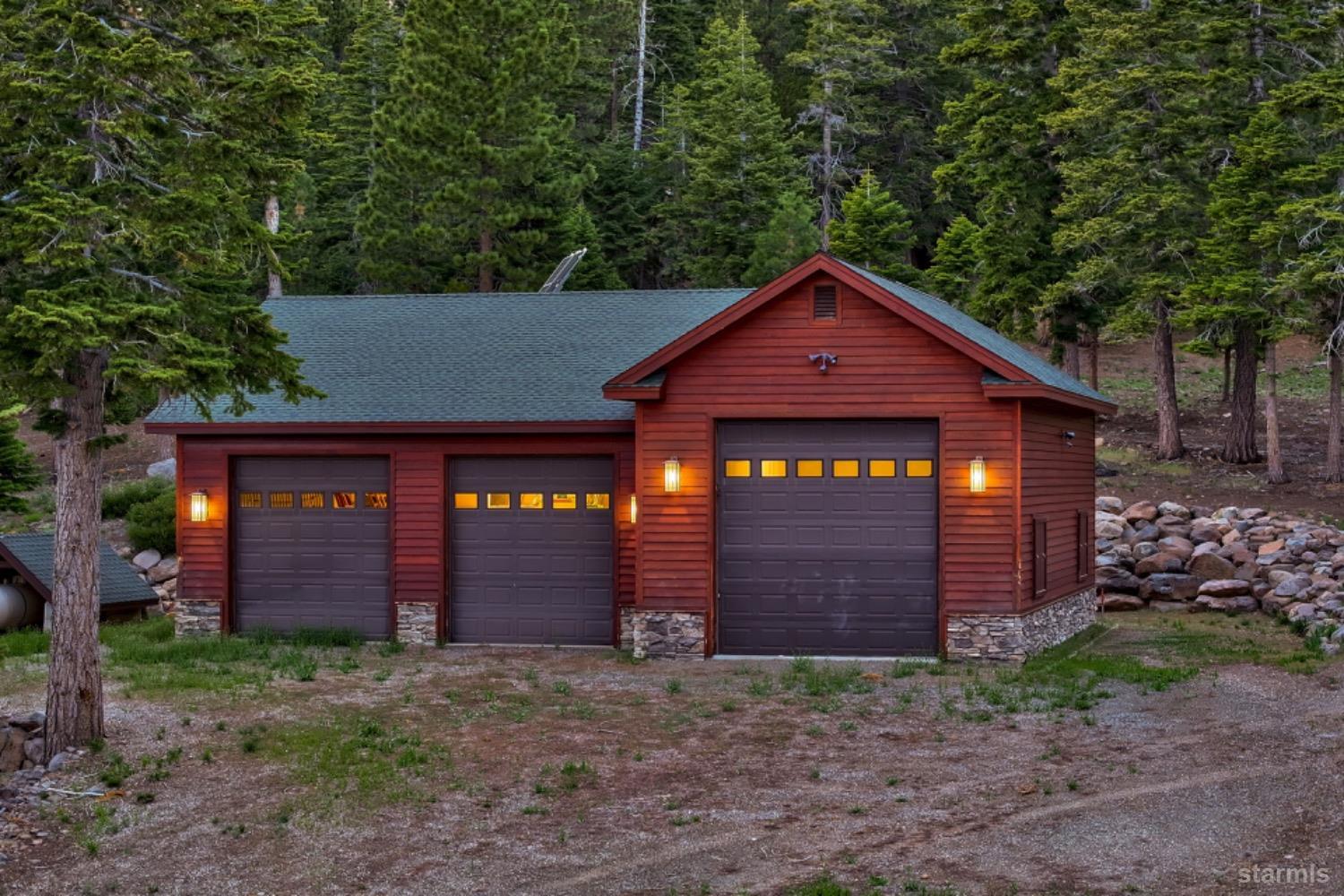 7000 Indian Creek Road Markleeville, CA 96120 - Photo 18 of 39 a front view of a house with a yard and garage