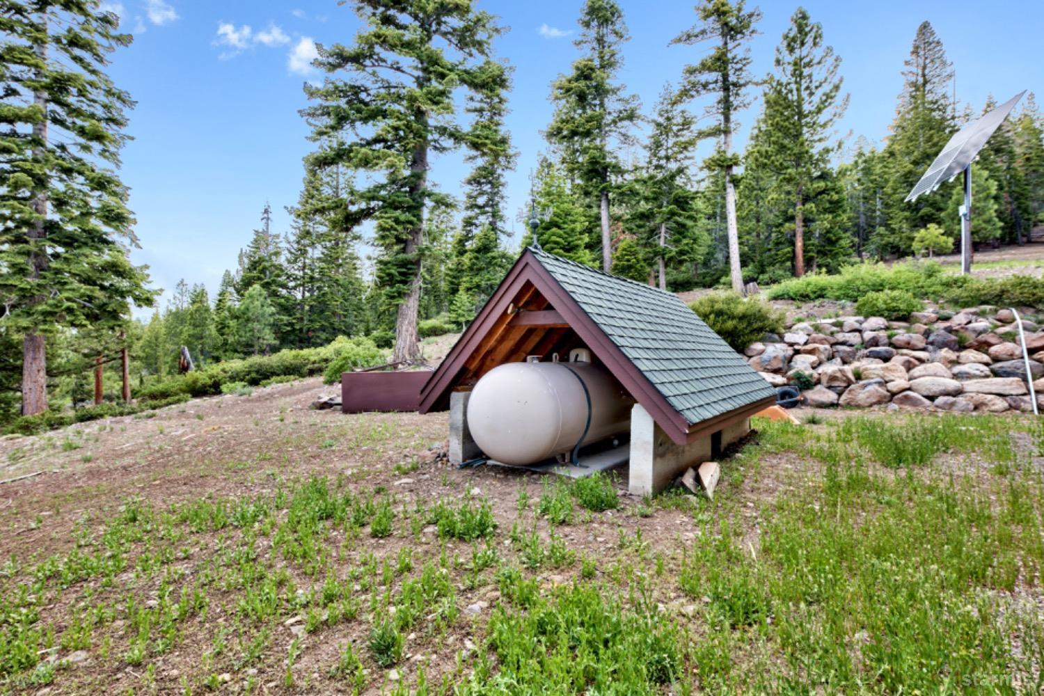 7000 Indian Creek Road Markleeville, CA 96120 - Photo 32 of 39 a view of a house with a backyard and trees