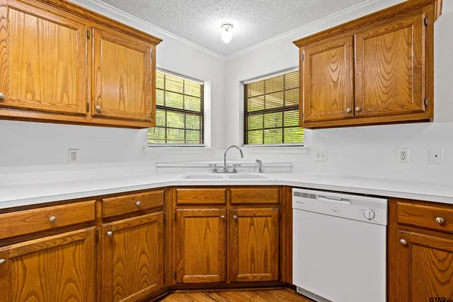 a kitchen with stainless steel appliances granite countertop cabinets and a sink